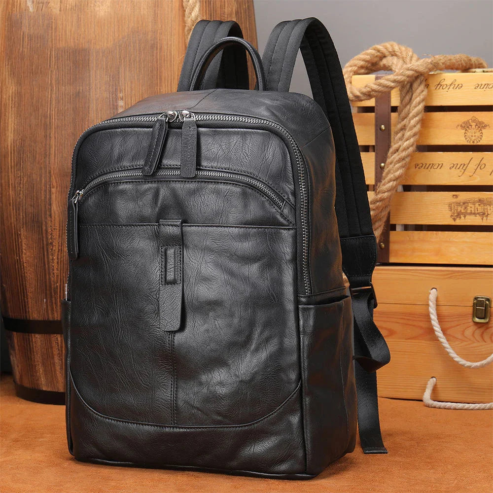 Femlion Black Leather Men's Backpack: Casual Travel Daypack for 14" Laptop